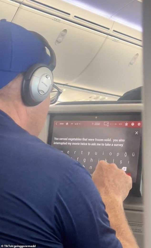 The man, wearing a blue T-shirt and matching reverse-back baseball cap, entered his complaint into a customer feedback form on the plane's screen