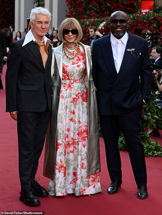 Editor-in-chief Dame Anna Wintour arrived with British Vogue's own editor Edward Enninful (R) amid rumors of a power struggle (pictured with Baz Luhrmann (L)