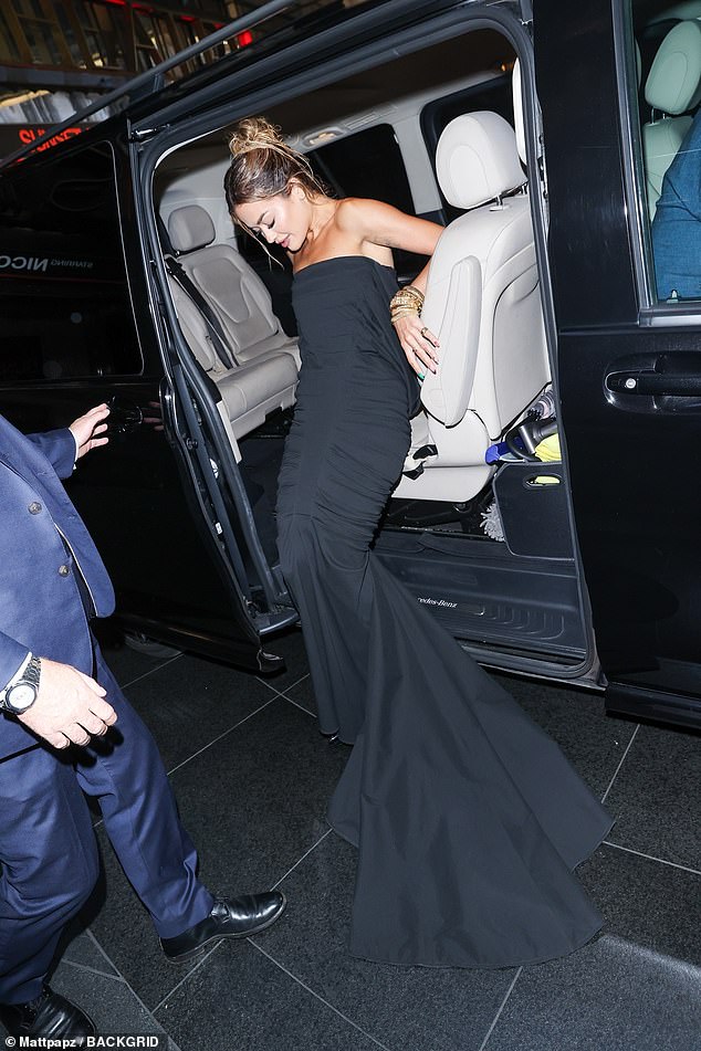 Difficulties: The singer struggled to move in her very tight outfit as she left her lavish hotel to head to the Theater Royal Drury Lane for the highly anticipated show