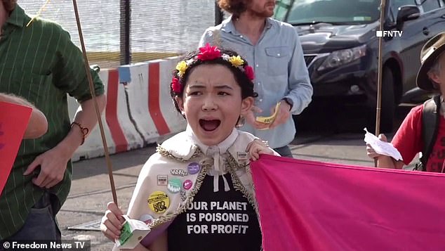 “Luxury emissions are destroying our future,” the group sang as they paraded past the entrance to the Manhattan helipad