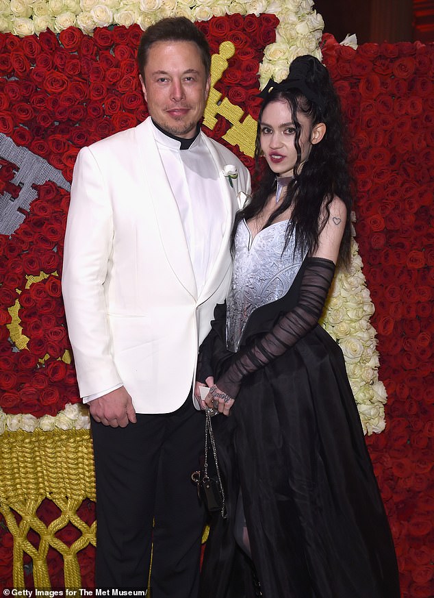 Rocky romance: Musk dated Claire Boucher, who goes by her stage name Grimes, for about three years, and the couple semi-broke up in March 2022, although they said at the time that they remained close (seen with Musk)