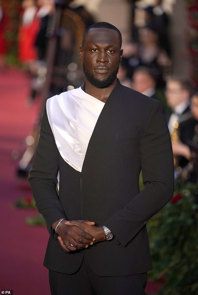 Slick: At the event that followed an Opening Night theme, rapper Stormzy, 30, showed off his polished sense of style in an asymmetrical suit, with white satin detailing