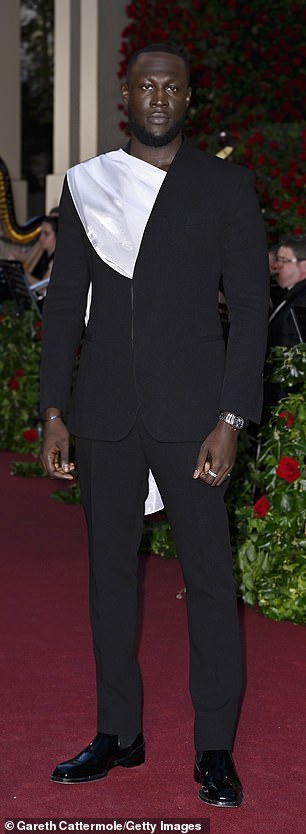 Smart: Stormzy completed his look with a pair of patent loafers