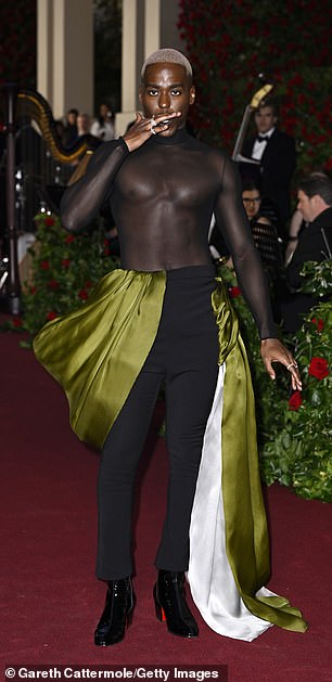 Wow: Actor Ncuti looked stunning in an edgy sheer top and black pants with a green satin train