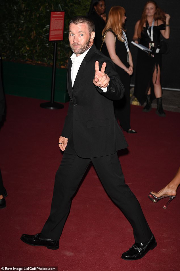 Traditional: Joel Edgerton, 49, opted for an all-black suit