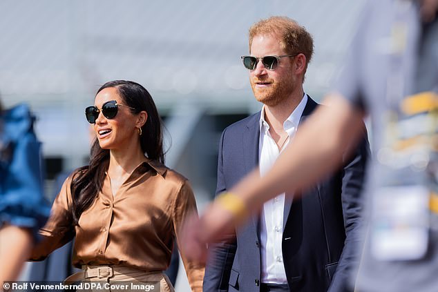 Although she has opted for cheap high street looks in her recent appearances, the Duchess went high-end today - and paired the look with £165 oversized Miu Miu sunglasses