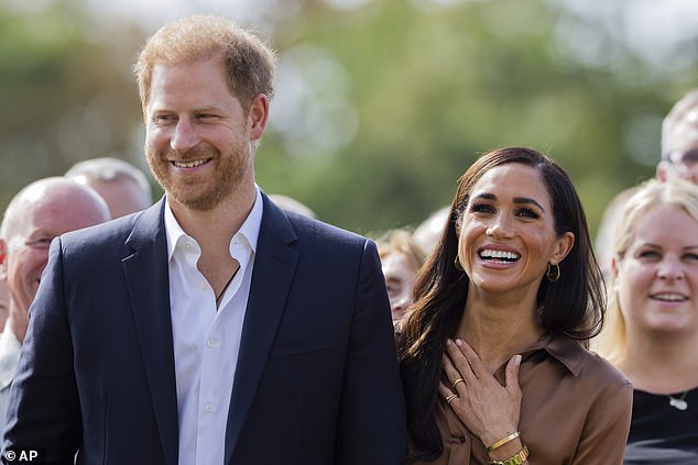 The mother of two, 42, opted for a monochrome ensemble with two shades of brown while wearing a $1,490 pair of Gabriel Hearst silk wide-leg trousers, which she previously wore to the 2022 One Young World roundtable.