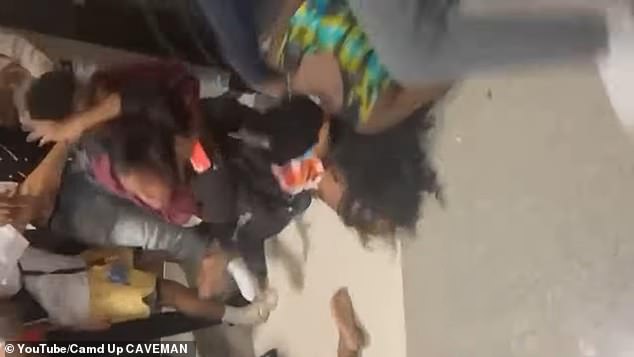 At one point the fighting also involved the school's principal, who tried to break up the fighting before ending up on the ground.