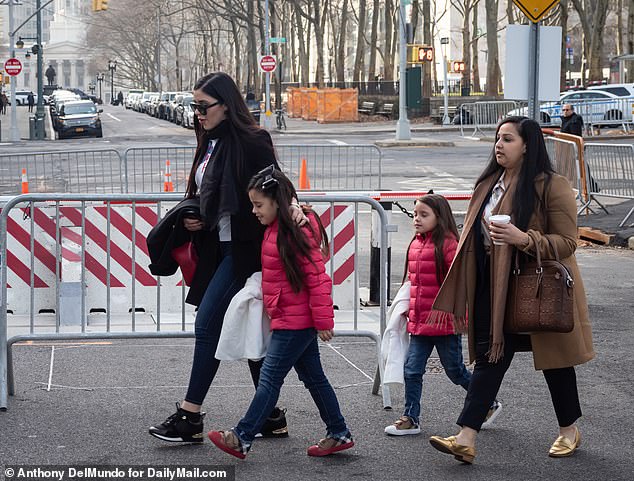 They have twin daughters: Emaly and Maria Joaquina.  (Photo: Coronel Aispuro and the children attending the trial of El Chapo)