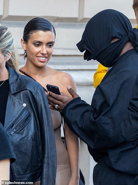 Worth a smile: Bianca appeared to be looking forward to her lunch as she stood next to Kanye