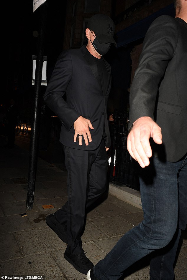 It's Leonardo DiCaprio!  The movie star, 48, did his best to hide under the radar as he headed into the exclusive venue to dance the night away