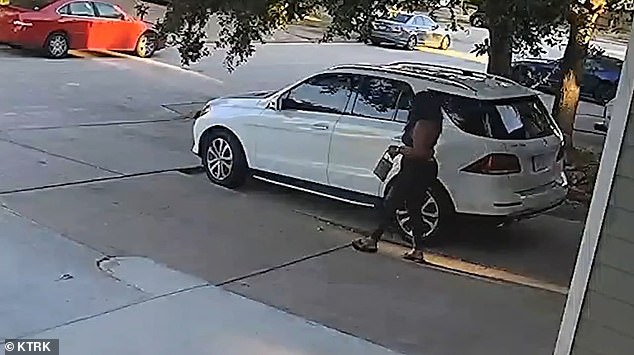 Surveillance footage obtained by ABC shows Timmons washing the hubcaps of a white Mercedes SUV