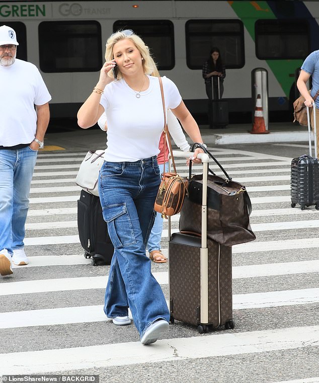 Savannah's look: She had black sunglasses on her blonde locks, while she accessorized with huge diamond earrings and lots of gold bracelets