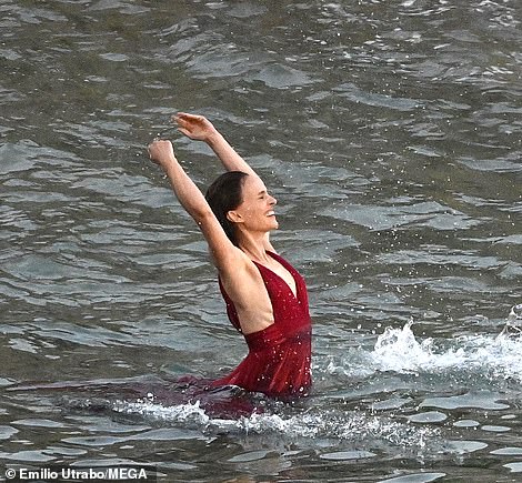 Brunette beauty: During the shoot, she looked ethereal as she glowed and played on the beach