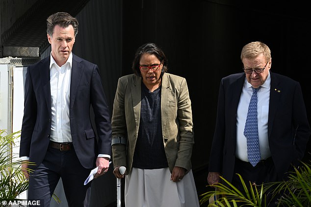 The retired athlete was flanked by NSW Premier Chris Minns (left) and IOC Vice President John Coates (right)