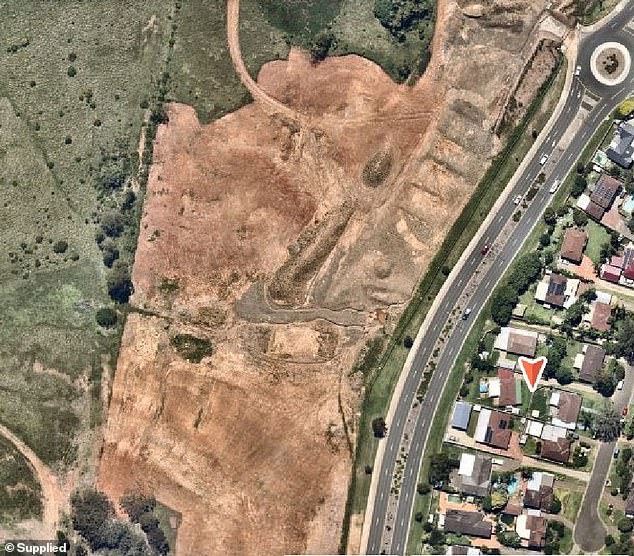 An aerial photo shows one side of the street consisting of vacant land.  One of those empty lots belongs to Mr. Le