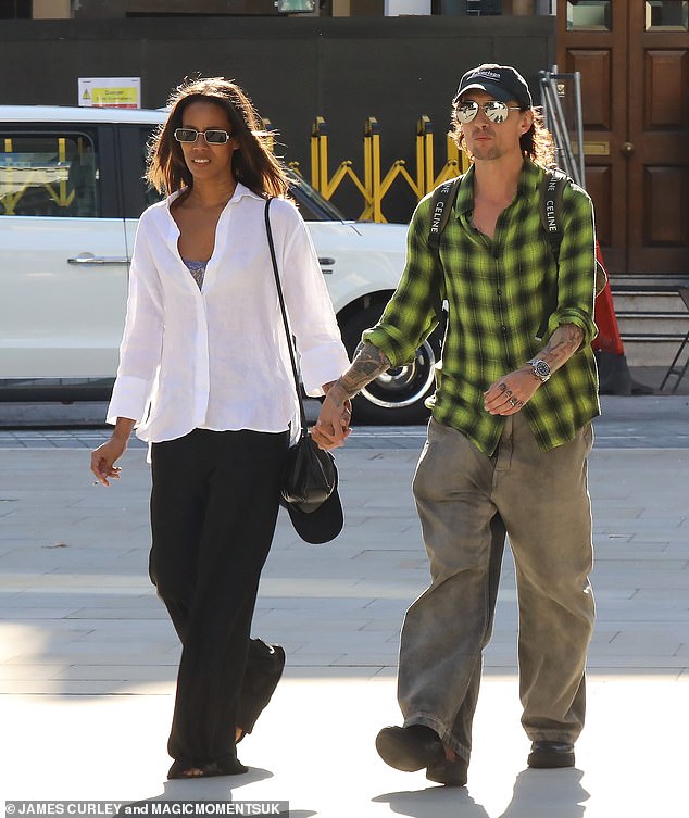 Changing times: However, Justin appeared to have moved on as he was spotted with the gorgeous brunette as they enjoyed a sunny stroll