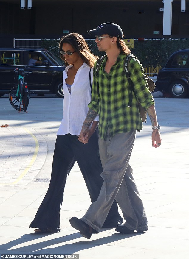 Cute: The pair made quite the couple as they strolled around the city