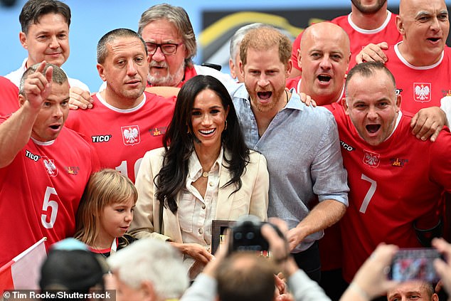 Harry and Meghan with the sitting volleyball team from Poland at the matches today