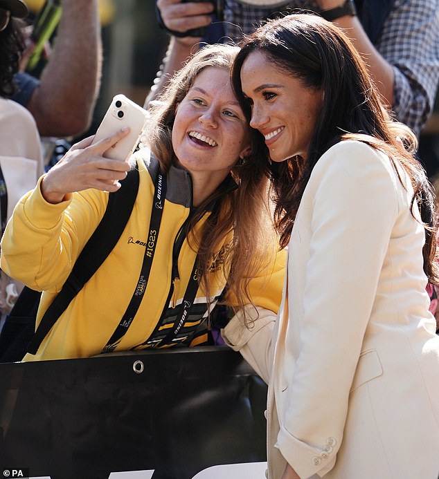 The mother-of-two, 42, beamed as she chatted to the delighted crowd waiting for a glimpse of the Duke and Duchess of Sussex