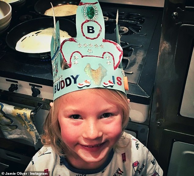 Little One: In the last photo, Buddy beamed in his school uniform as he wore the tall green headgear decorated with his age