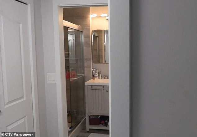 Forbes was in the shower, pictured here, when he said the two officers entered his home