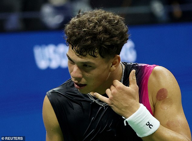 Shelton has his phone celebration after his quarterfinal match against Frances Tiafoe