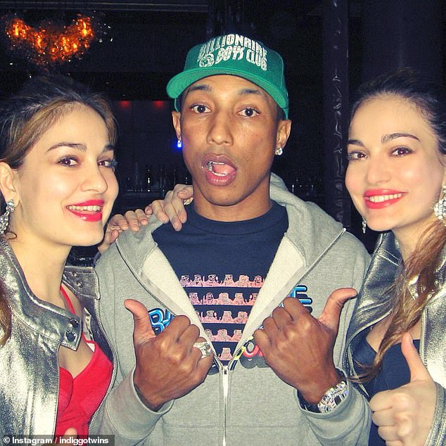 The two 40-year-old women, known as the 'Indiggo', have raised many concerns among parents visiting the park (pictured with Pharrell Williams)