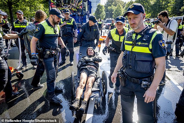 Demonstrators were taken away by the police in The Hague