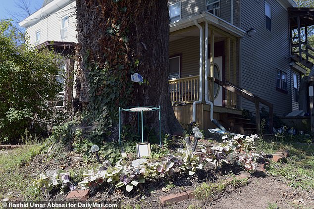 A small shrine to Deborah still stands poignantly next to a tree outside her former apartment, where she lived for just three months