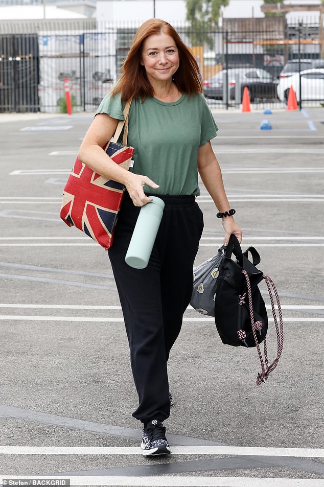 Beaming face: Alyson Hannigan also arrived on the same day to practice with her partner, Sasha Farber.  The How I Met Your Mother actress looked radiant with a makeup-free face as she entered the studio