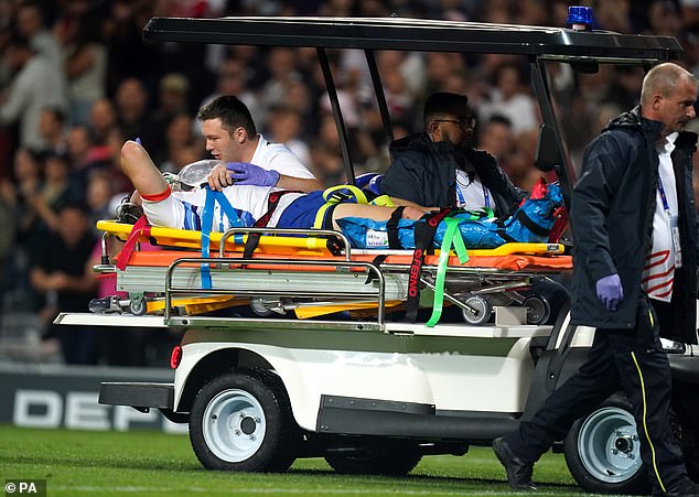 Play was stopped for seven minutes as the center received treatment and oxygen on the pitch