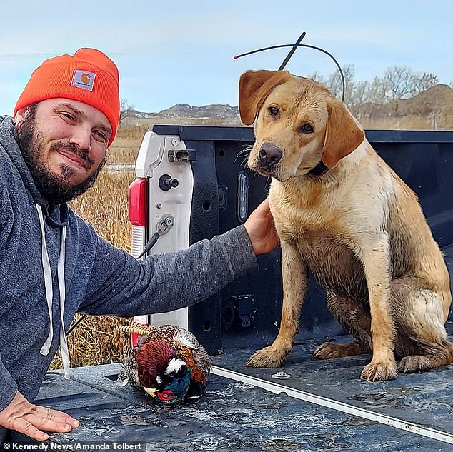 Here Mike is pictured with his trusted canine companion Cody.  The dog was snarling and looking very bewildered at the flying trout