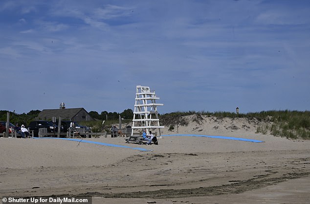 Several people were pictured in East Hampton on Friday watching the waves roll in