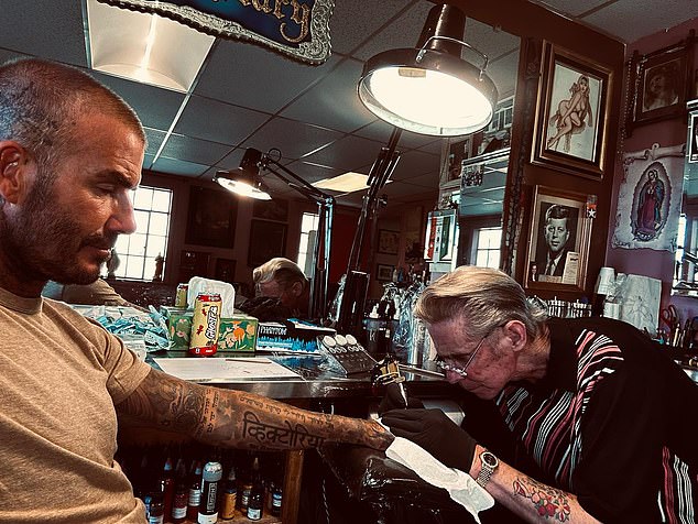 Loved Ones: David shared that 'one of the tattoos I have is of family' (he is pictured getting the 'Posh' finger tattoo at Shamrock Social Club in West Hollywood)