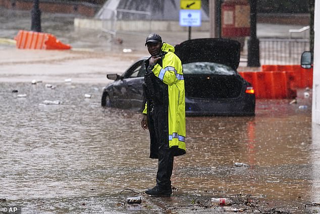 Heavy rain swept through the flooded streets of downtown Atlanta