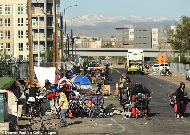 The pop-up tavern is set up on the sidewalk of 23rd and Champa streets, where the city's growing homeless population has made an encampment