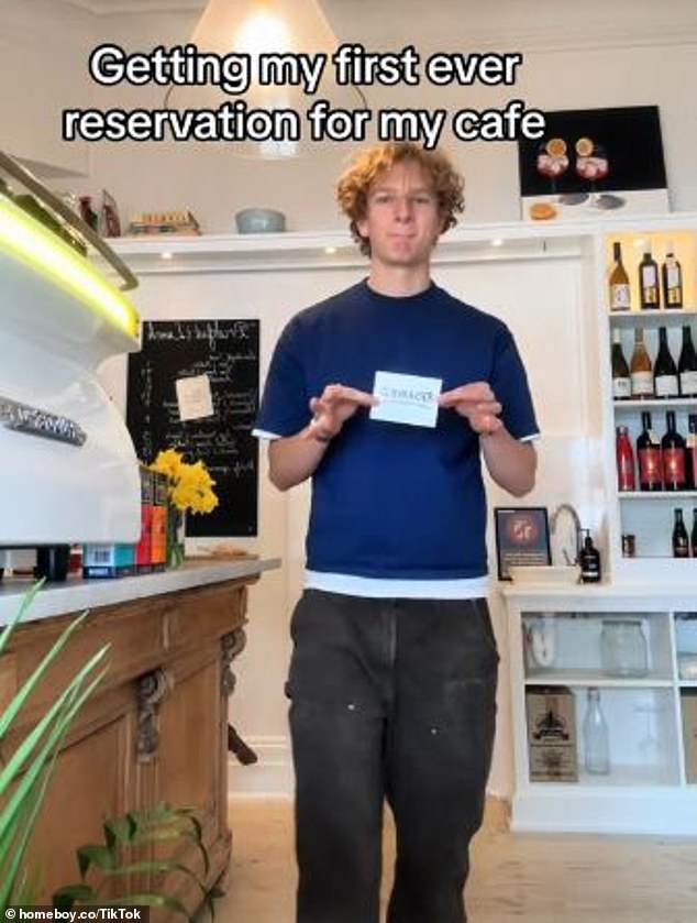 In August, the teenager celebrated the coffee shop's first reservation and filmed himself placing a handmade 'reserved' sign on one of the tables (pictured)
