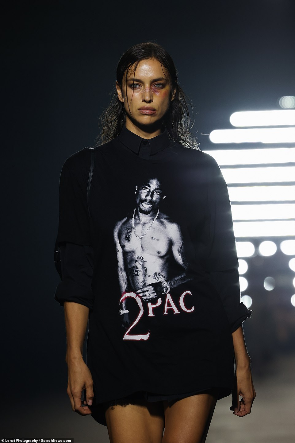 Tribute to the legend: the leggy supermodel wore a 2Pac T-shirt during the runway show;  seen on Friday