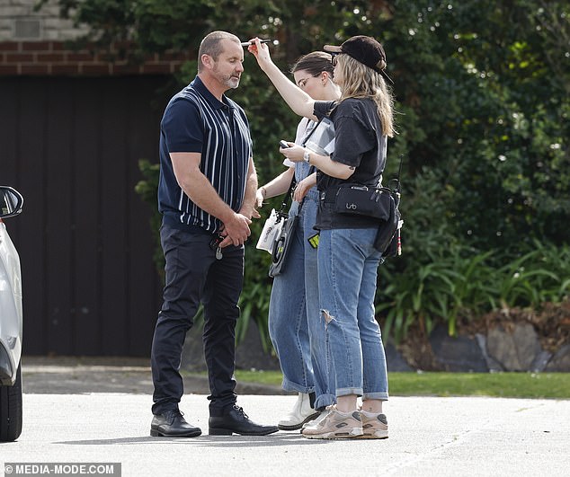 Later in the scene, Ryan had to change costumes as the soap star swapped his business casual clothes for his usual jeans and striped shirt.