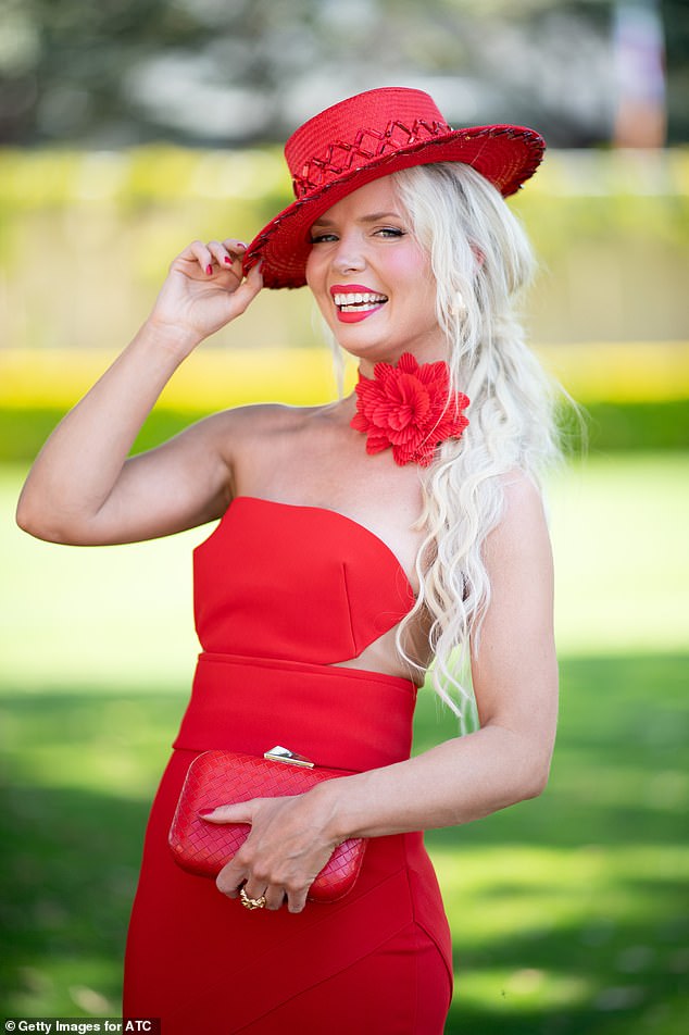 Stacey changed the look even more by adding a bright red hat she designed herself and a red floral tie