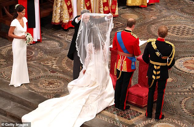 The back of the dress, which had a modest train of two meters and 70 centimeters, was finished with 58 gazar and organza covered buttons finished with Rouleau loops