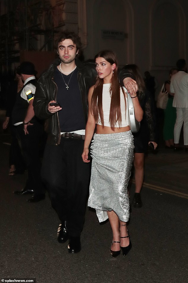 Couple: Lennon was joined for the event by his girlfriend Izzy Richmond, who looked stunning in a white crop top and silver skirt