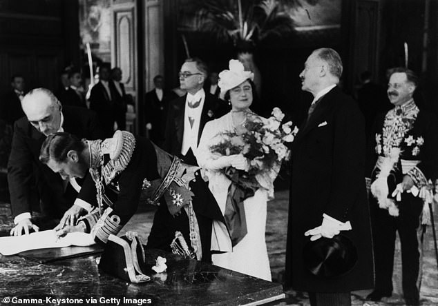 George VI and Queen Elizabeth visit a Paris town hall during the 1938 state