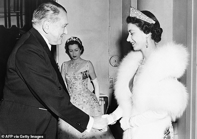 Queen Elizabeth II exudes glamor during a state visit to France in April 1957. She is greeted by President Rene Coty