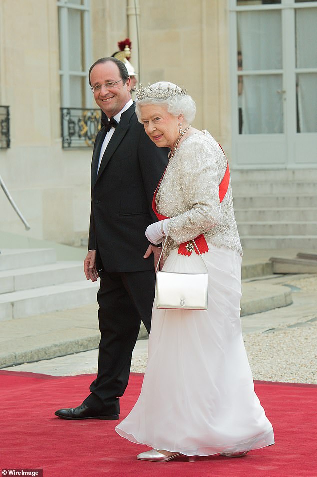 During the Queen's last state visit in 2014, she met President Francois Hollande at the Elysee Palace for a state dinner to mark the 70th anniversary of the Normandy landings.