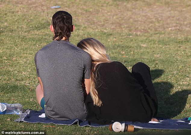 The couple looked very much in love as they shared the towel