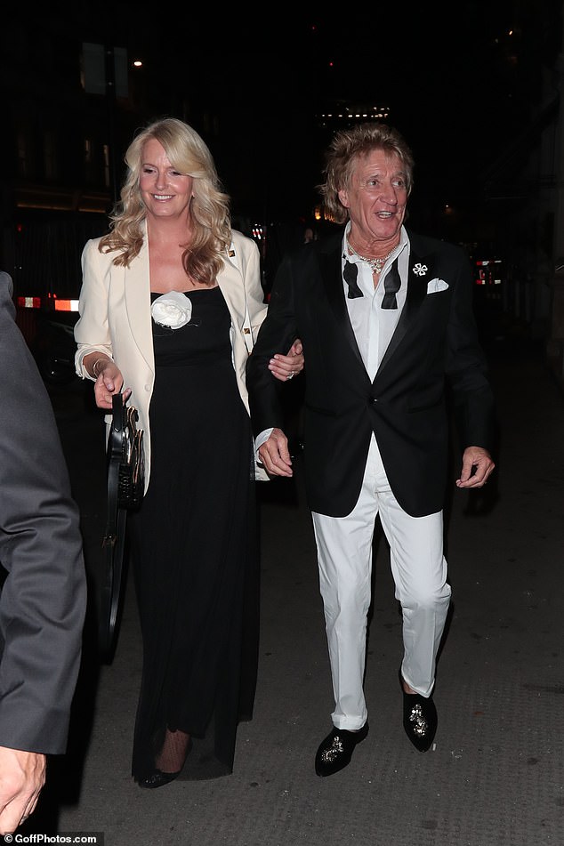 On the way home: The couple were photographed leaving the event with Penny supporting the singer