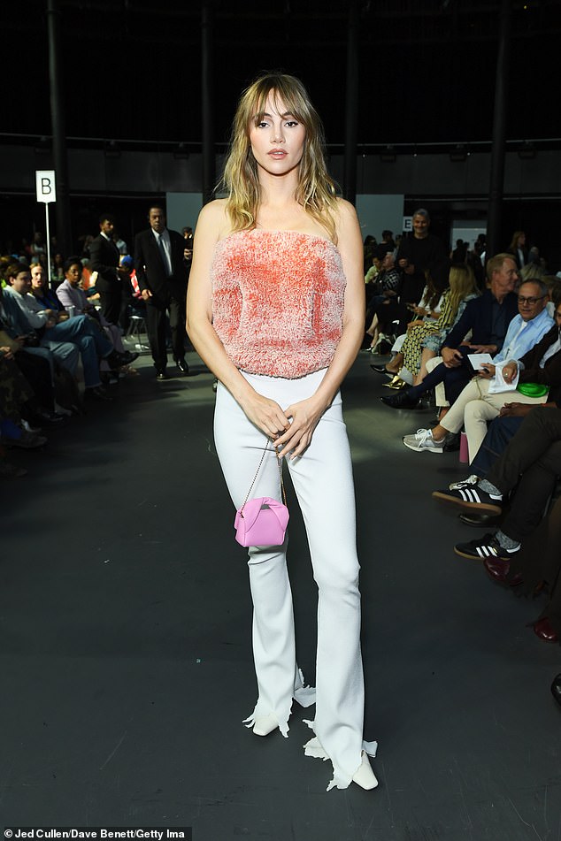 Posing up a storm: The model, 31, looked effortlessly chic as she posed up a storm before taking her seat in the front row