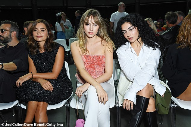 Front row: The beauty looked stunning as she sat in the front row and posed with English actress Jenna Coleman and singer Charli XCX